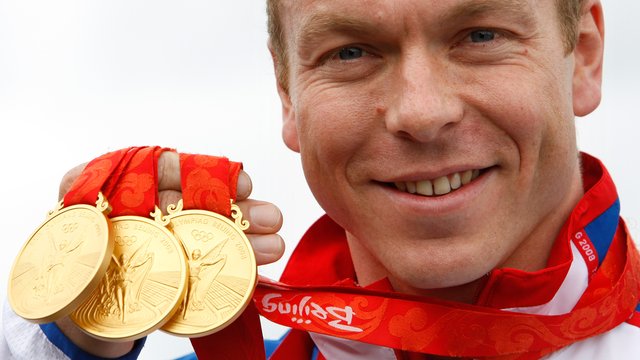 Chris Hoy with his 3 gold medals round his neck