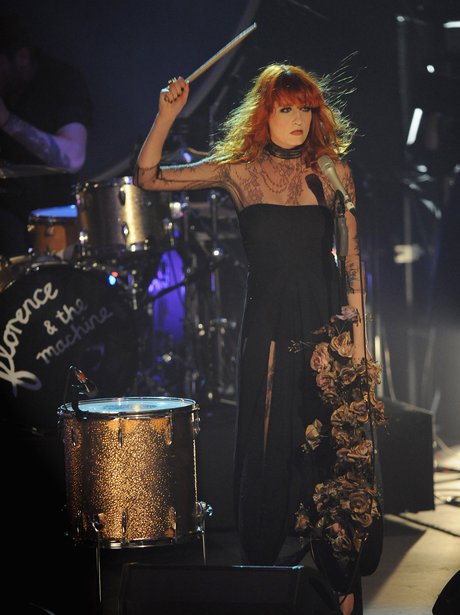 Florence Welch banging a drum