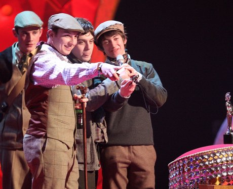 Arctic Monkeys wearing tweed at the BRIT Awards