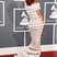 Image 9: Rihanna in white striped gown at the Grammy  Arrivals 2011