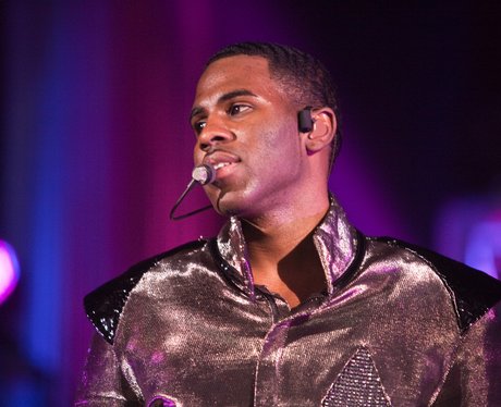 Jason Derulo wearing a gold jacket