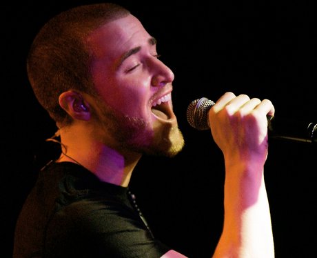 Mike Posner performs on stage