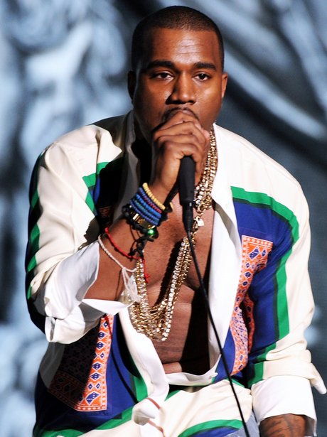 Kanye West wearing unbuttoned shirt