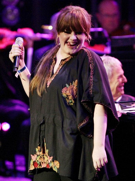 Adele singing on stage