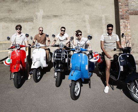 The Wanted sitting on mopeds