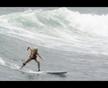 Lady Gaga surfing at sea