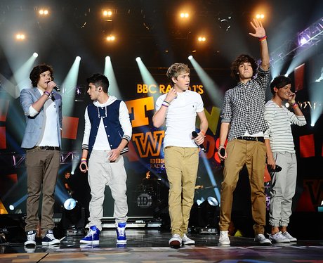 One Direction performing first song 'What Makes You Beautiful' on stage in London