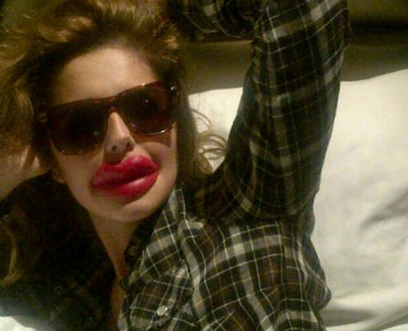 Cheryl Cole poses with fake lips for a joke about plastic surgery in LA