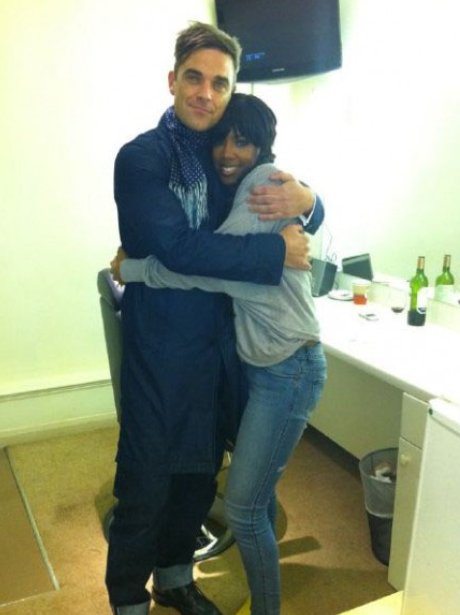 Kelly Rowland and Robbie Williams hugging