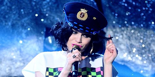 Jessie J wearing a policewoman's helmet