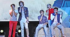 One Direction perform on their tour