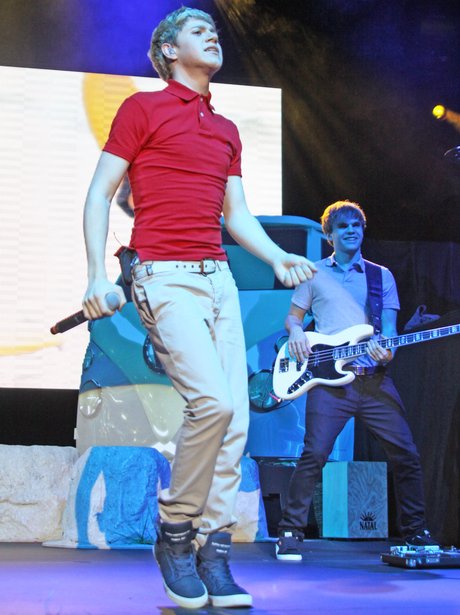 One Direction perform on their tour