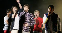 One Direction performing live in concert