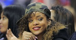 RIhanna watches basketball game