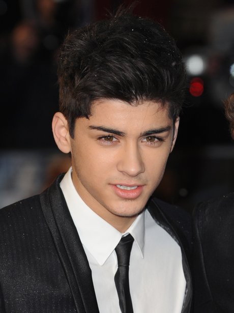Zayn Malik in a suit and tie.