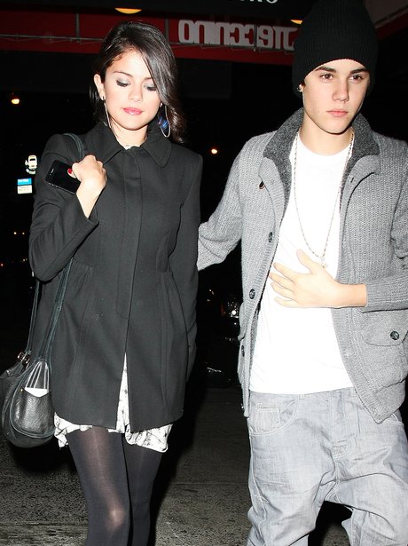 Justin Bieber and Selena Gomez are pictured leaving a restaurant