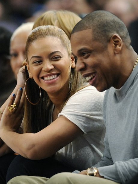 Beyonce and Jay-Z watching basketball