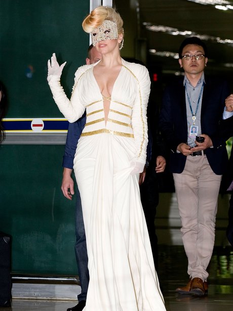Lady Gaga wears a low cut dress
