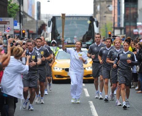 Torchbearer carries flame from Media City