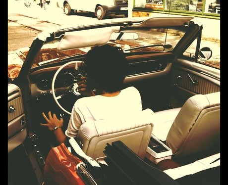 Harry Styles in a Mustang