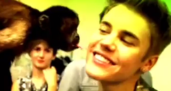 Justin bieber kissed by monkey