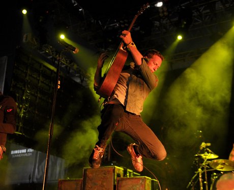 Coldplay perform live on stage