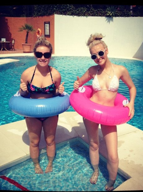 Perrie Edwards on holiday wearing a rubber ring