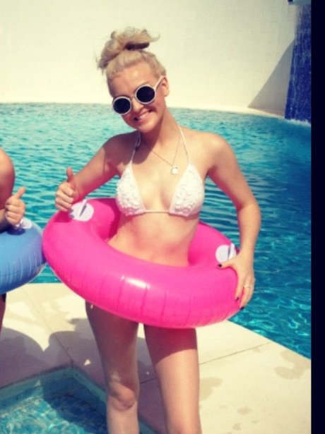 Little Mix's Perrie Edwards with pink rubber ring
