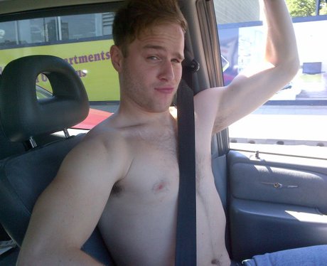Olly Murs topless in a car
