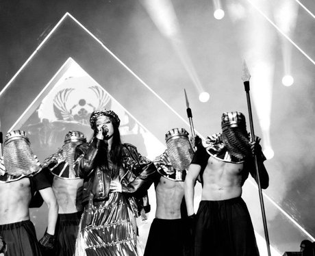 Rihanna and backing dancers perform live on stage