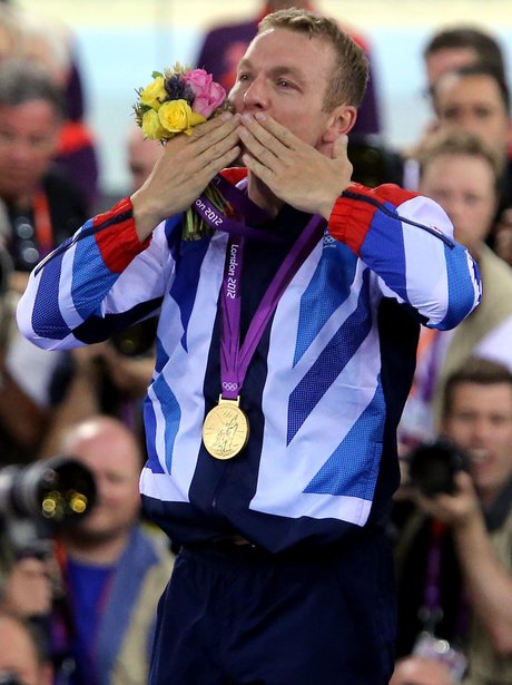 Chris Hoy celebrates winning a gold medal
