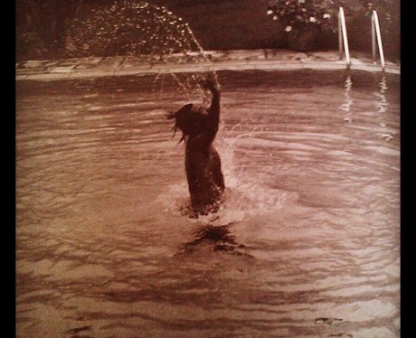 Harry Styles in a swimming pool