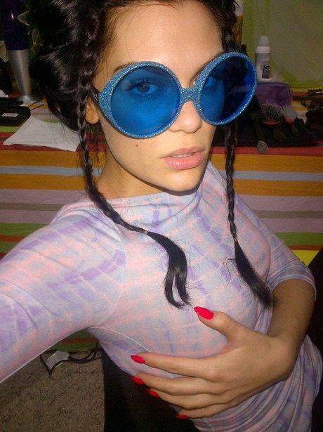 Jessie J wearing big blue glasses