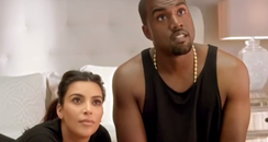Kanye West and Kim Kardashian on bed