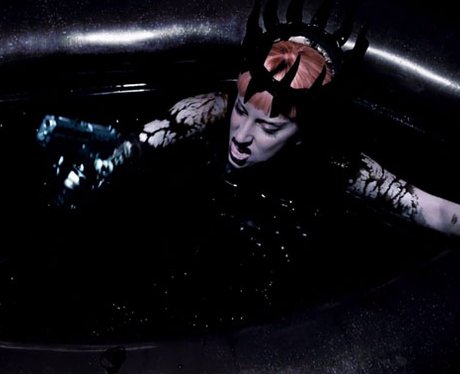 Lady Gaga baths in Fame perfume