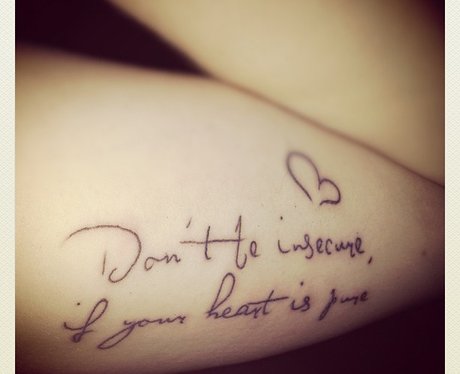 A fan shows off their Lady Gaga tattoo.