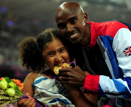 Mo Farah and daughter with gold medal