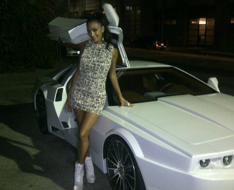 Nicole Scherzinger leans on Will.i.am's car.