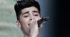 Zayn Malik of One Direction perform on stage