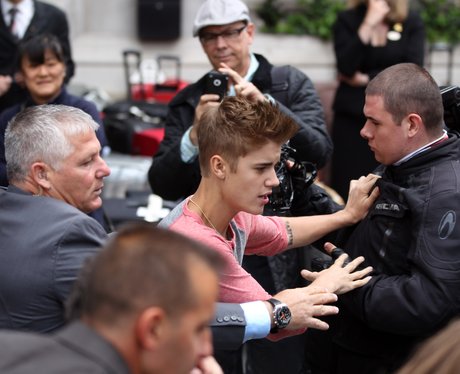 Justin Bieber meets fans outside his hotel.