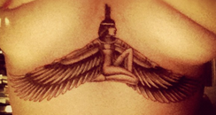 Rihanna shows of her new tattoo