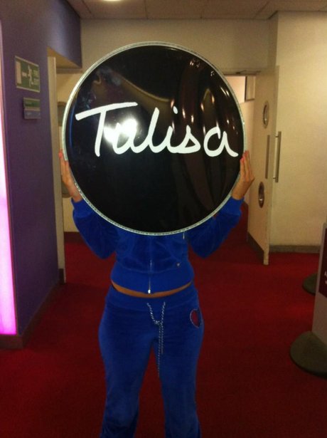 Tulia standing with drum logo