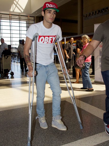 One Direction's Zayn Malik on crutches.