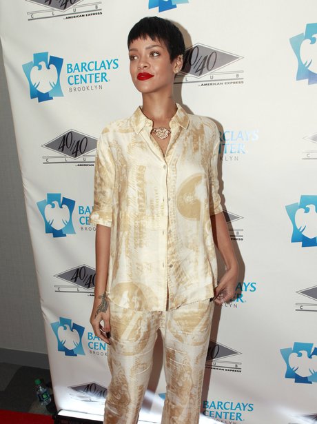 Rihanna wearing a matching silk trouser suit