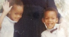 Rihanna as a baby in a picture with her family
