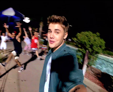 Justin Bieber holding camera