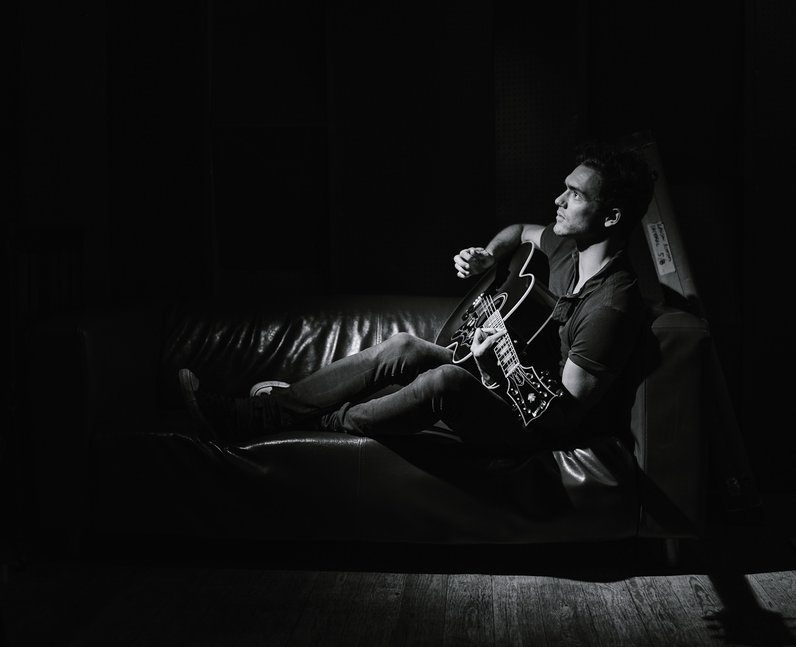 Lawson's Andy Brown playing guitar