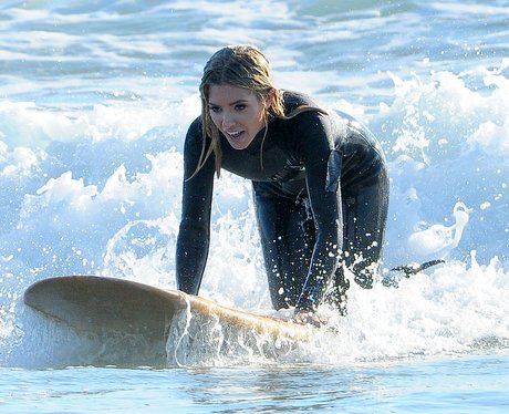 The Saturdays Mollie King on surfboard