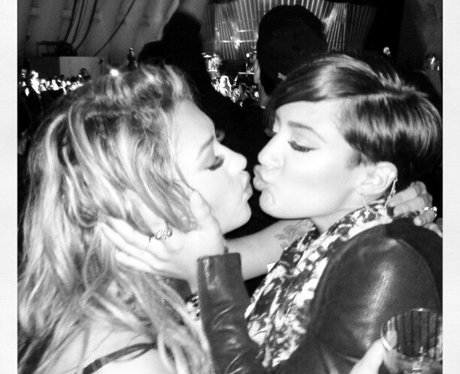 Vanessa White and Frankie Sandford kissing.