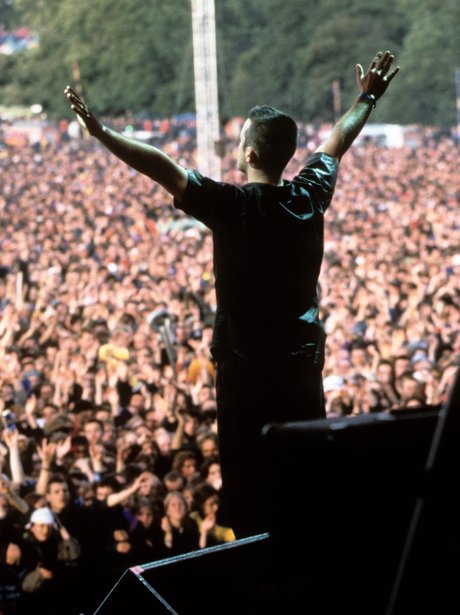 Robbie Williams performs at Glastonbury 1996